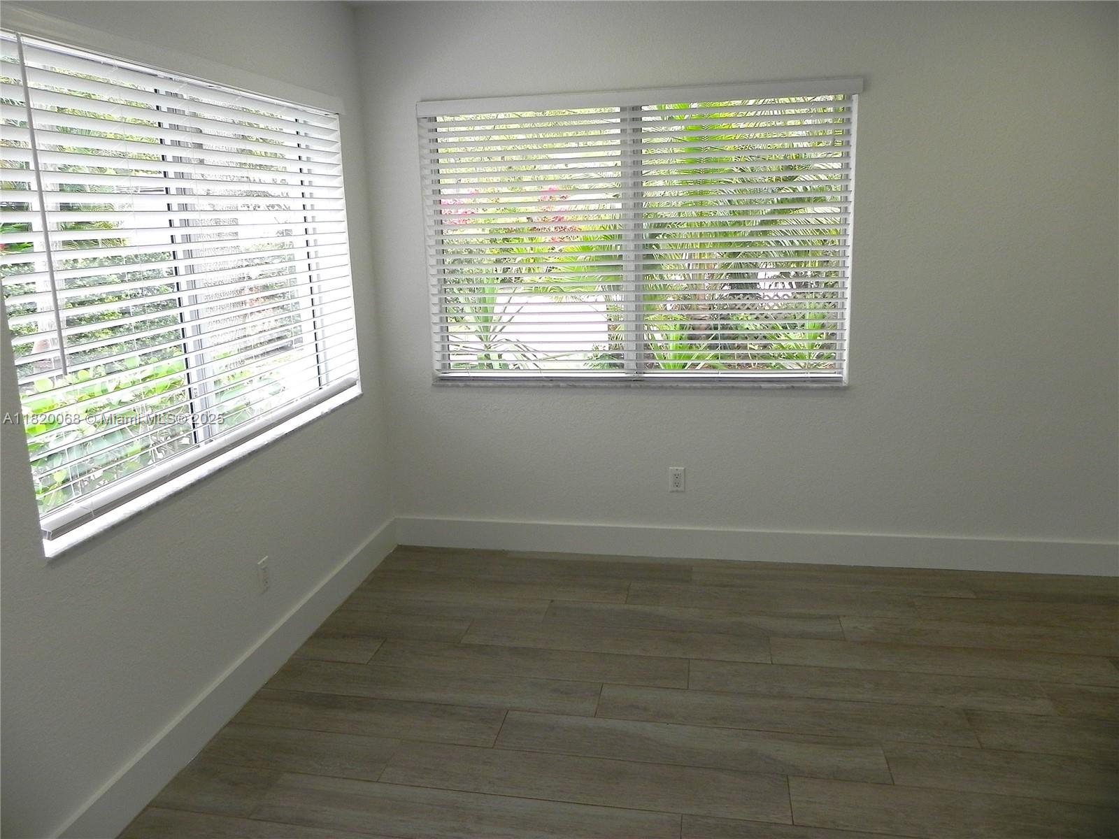 Bayside Miami, FL 33138 - Photo 11 of 44 a view of an empty room with a window