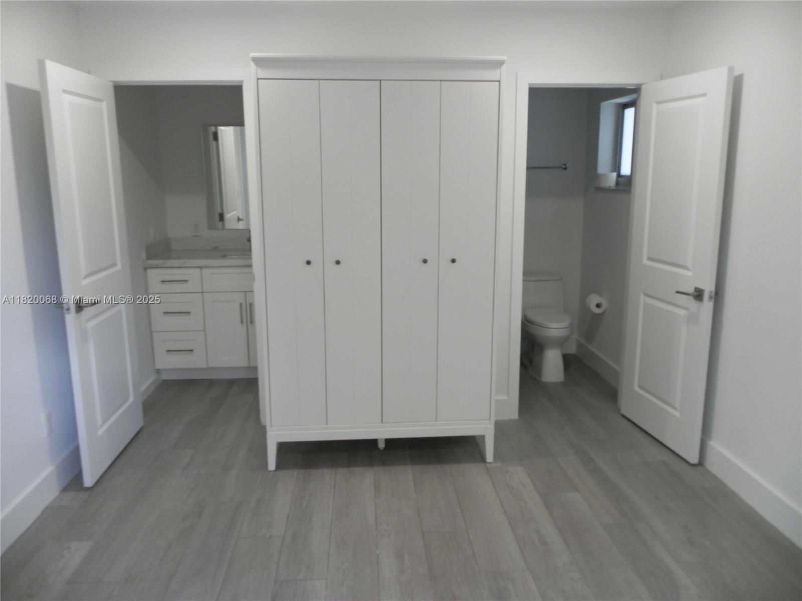 Bayside Miami, FL 33138 - Photo 16 of 44 a view of a bathroom with a sink and toilet