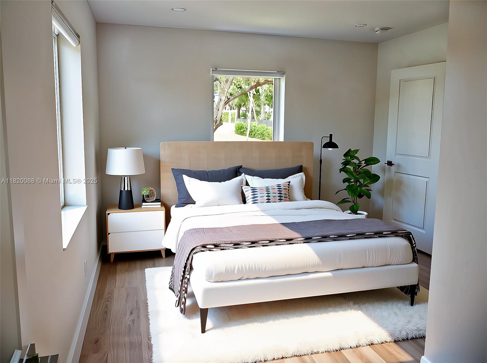 Bayside Miami, FL 33138 - Photo 17 of 44 a bedroom with a bed and a lamp