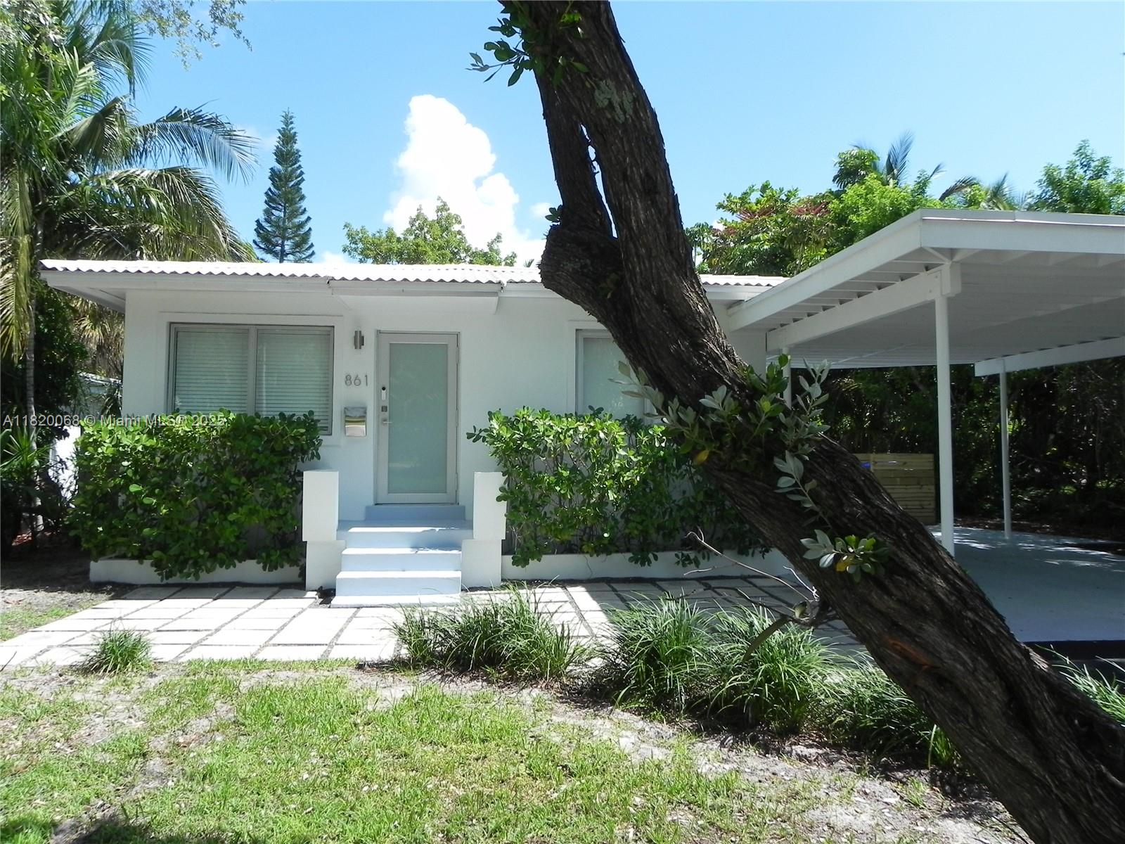 Bayside Miami, FL 33138 - Photo 2 of 44 a front view of a house with a yard