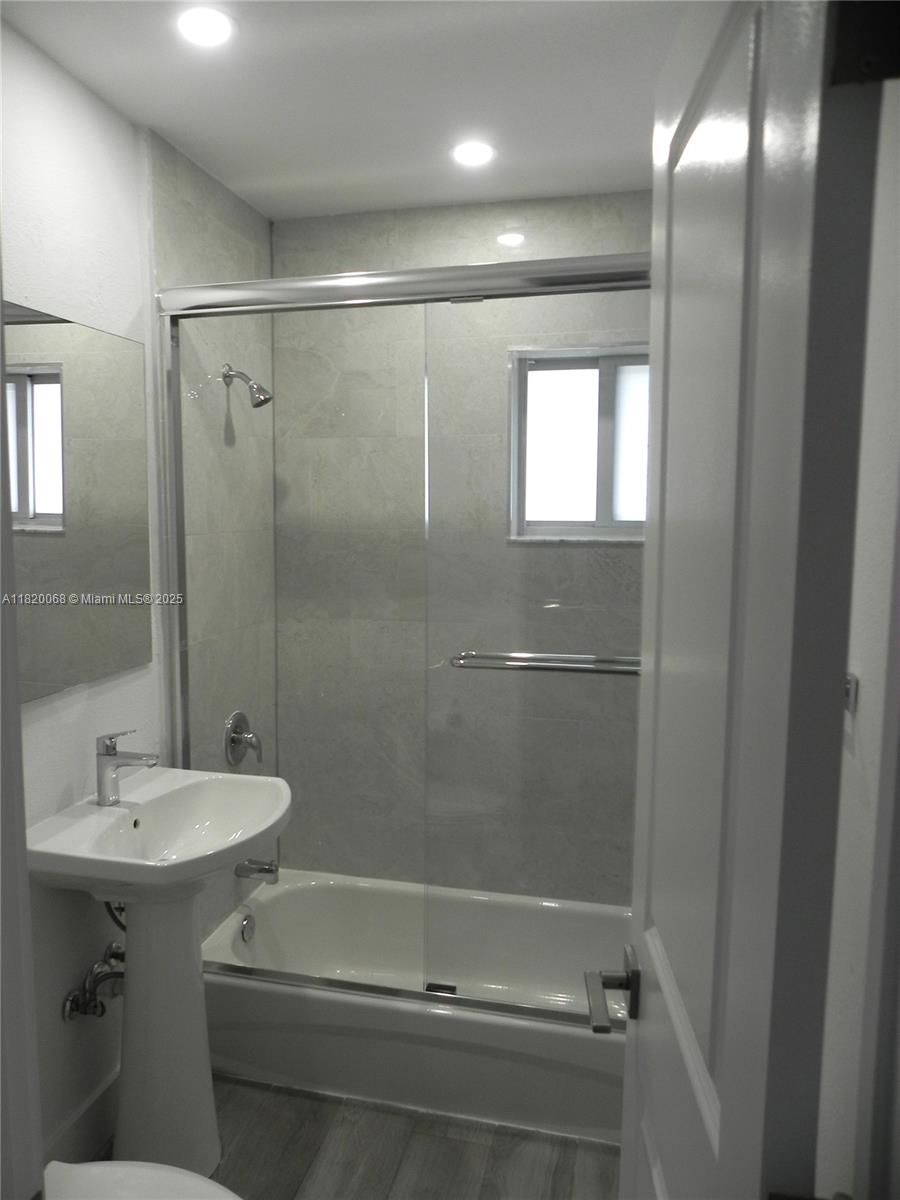 Bayside Miami, FL 33138 - Photo 24 of 44 a bathroom with a sink a toilet and shower