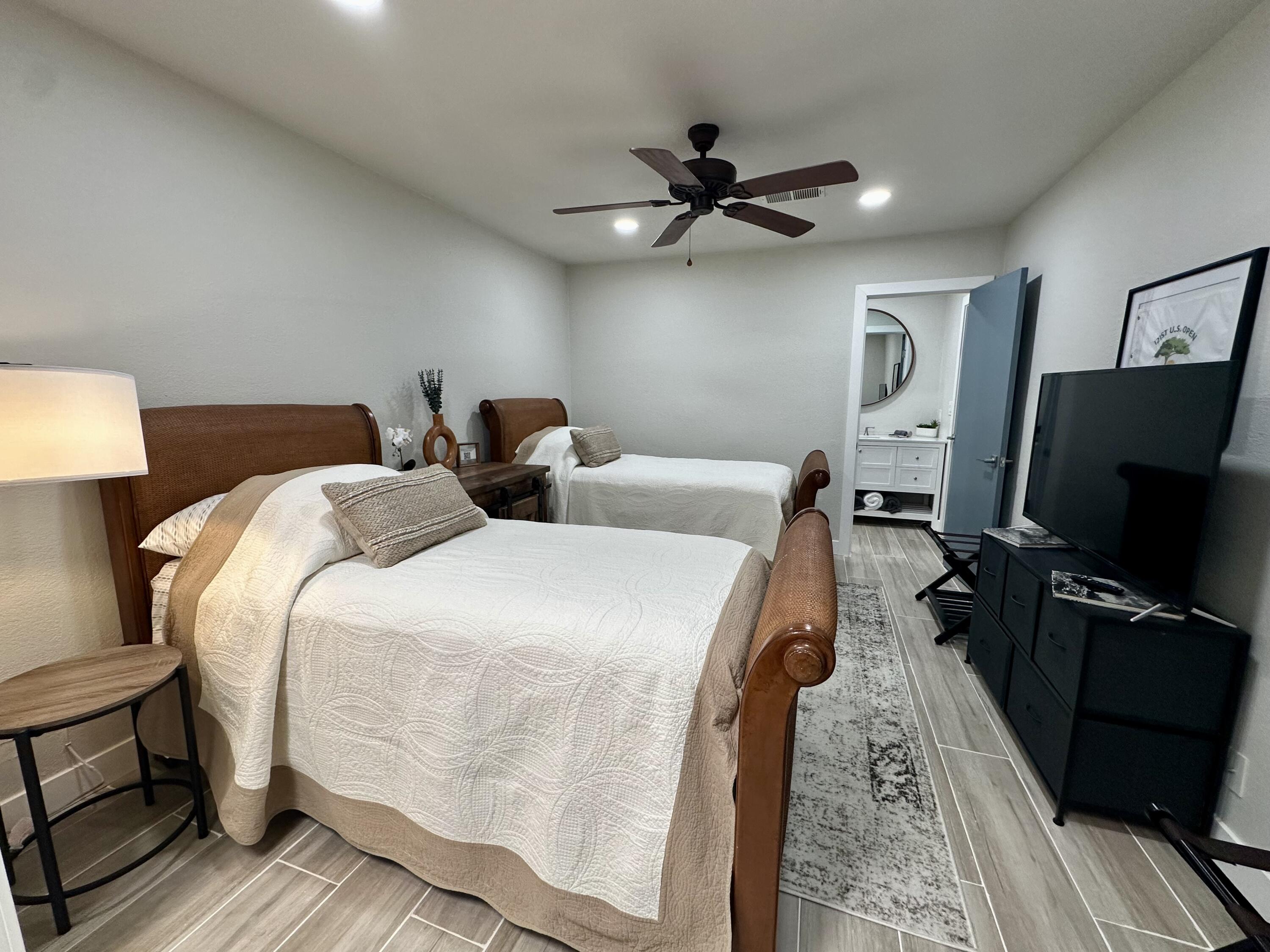 246 Santa Barbara Circle Palm Desert, CA 92260 - Photo 15 of 16 a bedroom with bed tv and a window