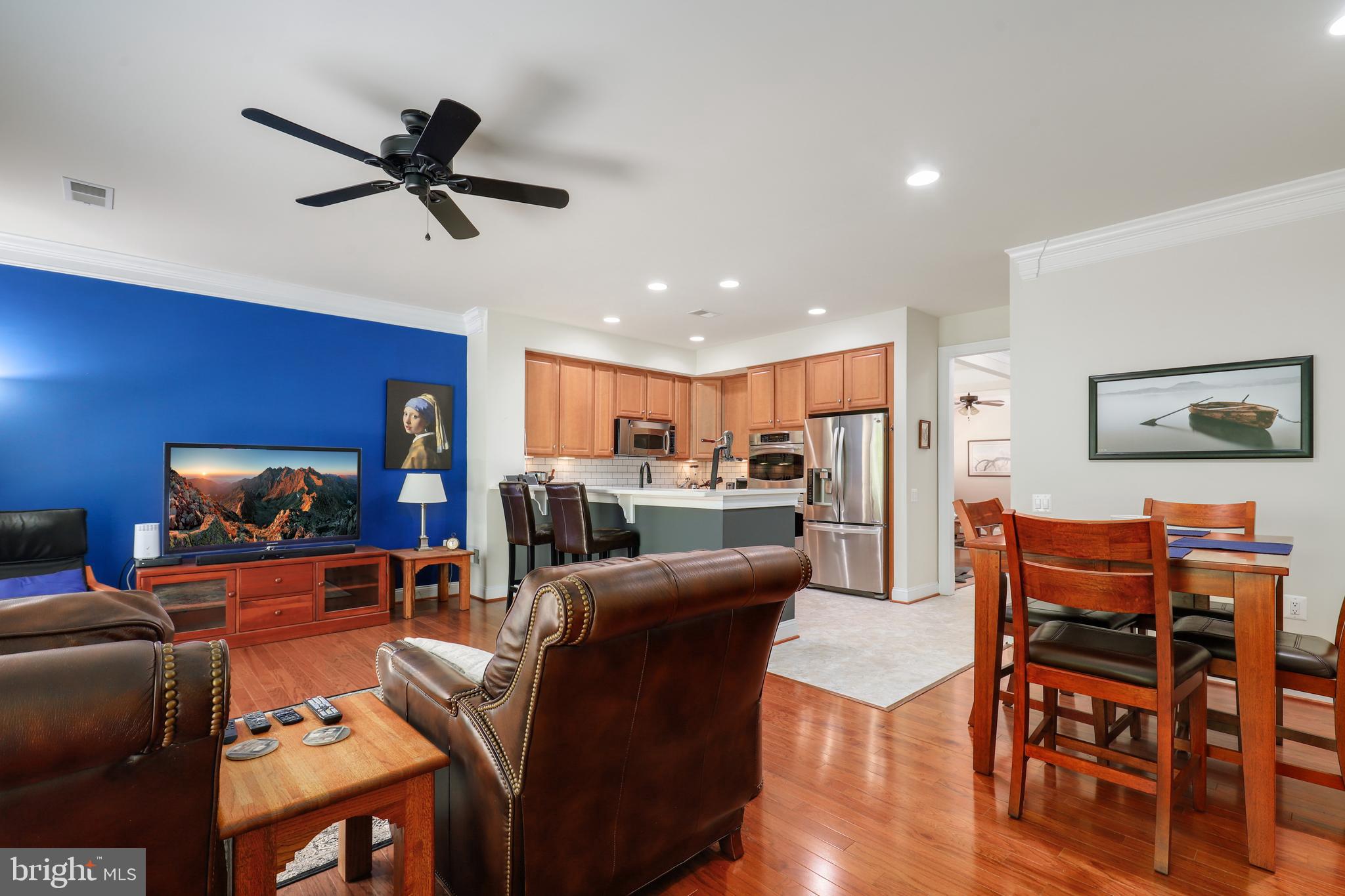 44268 Panther Ridge Drive Ashburn, VA 20147 - Photo 11 of 32 a living room with furniture and a view of kitchen