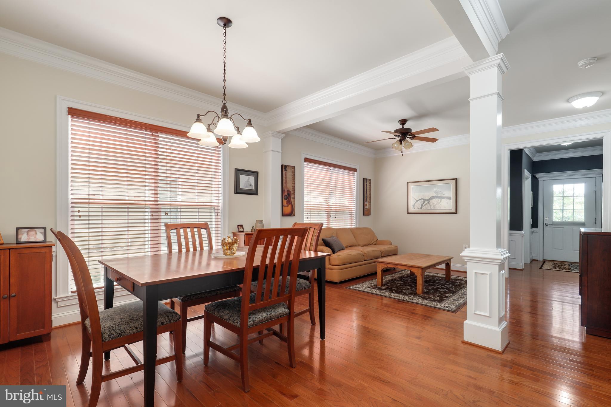 44268 Panther Ridge Drive Ashburn, VA 20147 - Photo 14 of 32 a view of a dining room with furniture window and wooden floor