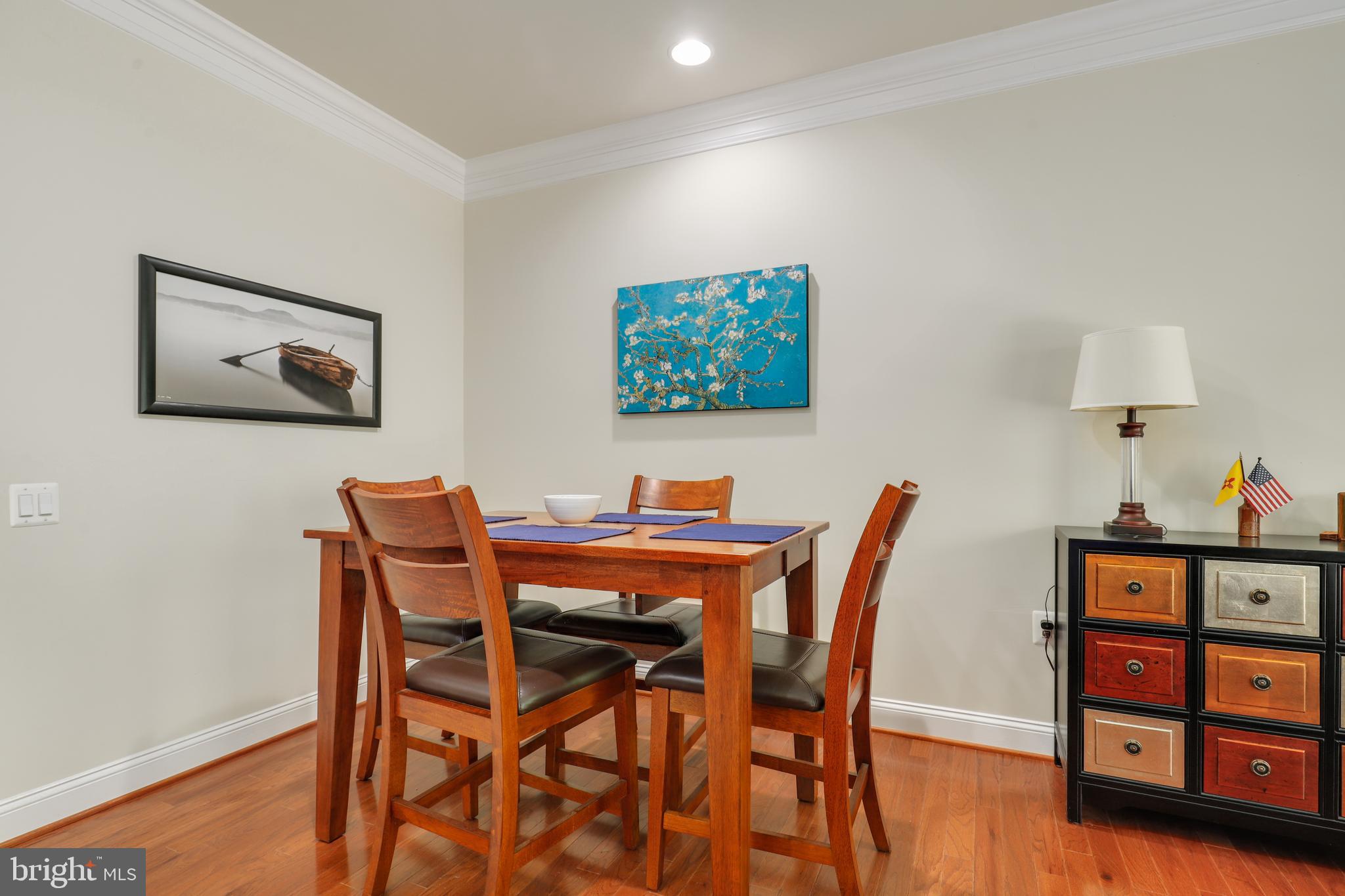 44268 Panther Ridge Drive Ashburn, VA 20147 - Photo 15 of 32 a view of a dining room with furniture and wooden floor