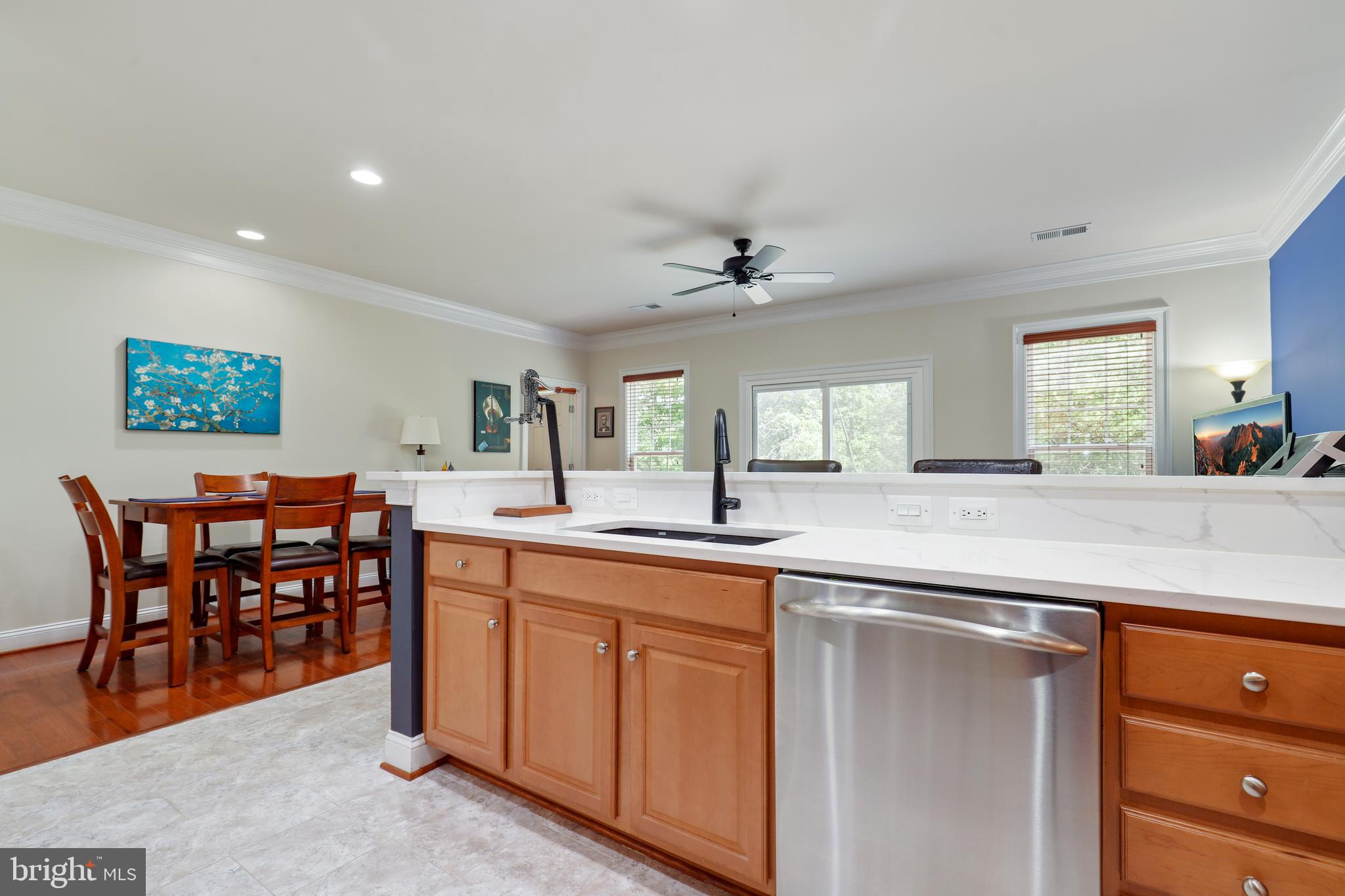 44268 Panther Ridge Drive Ashburn, VA 20147 - Photo 16 of 32 a large kitchen with a table and chairs