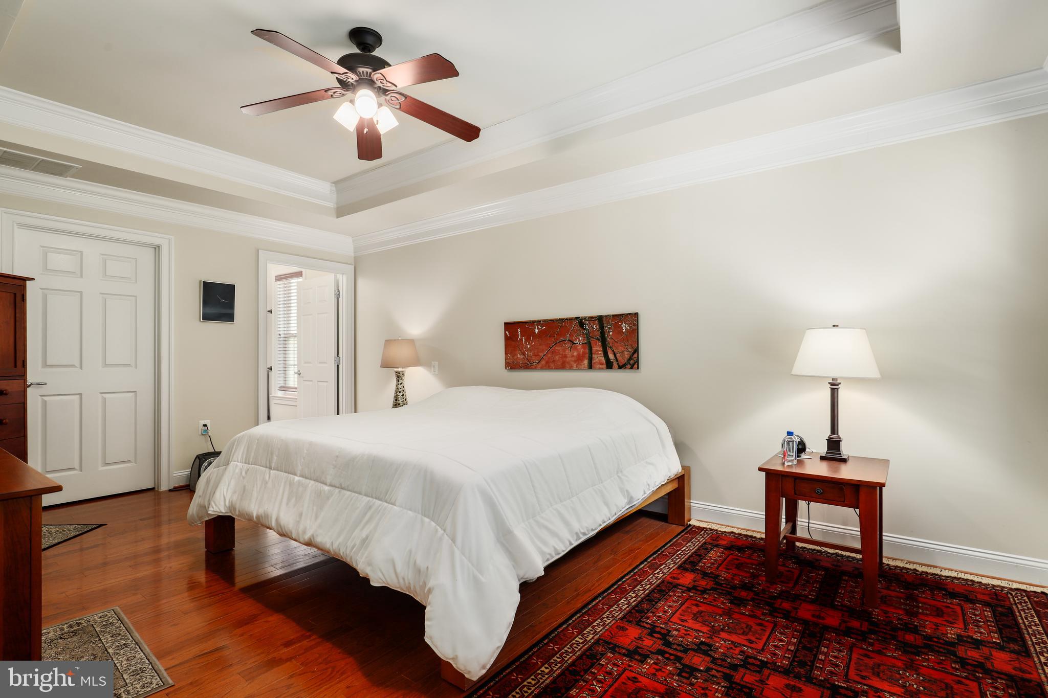44268 Panther Ridge Drive Ashburn, VA 20147 - Photo 21 of 32 a bedroom with bed and a table