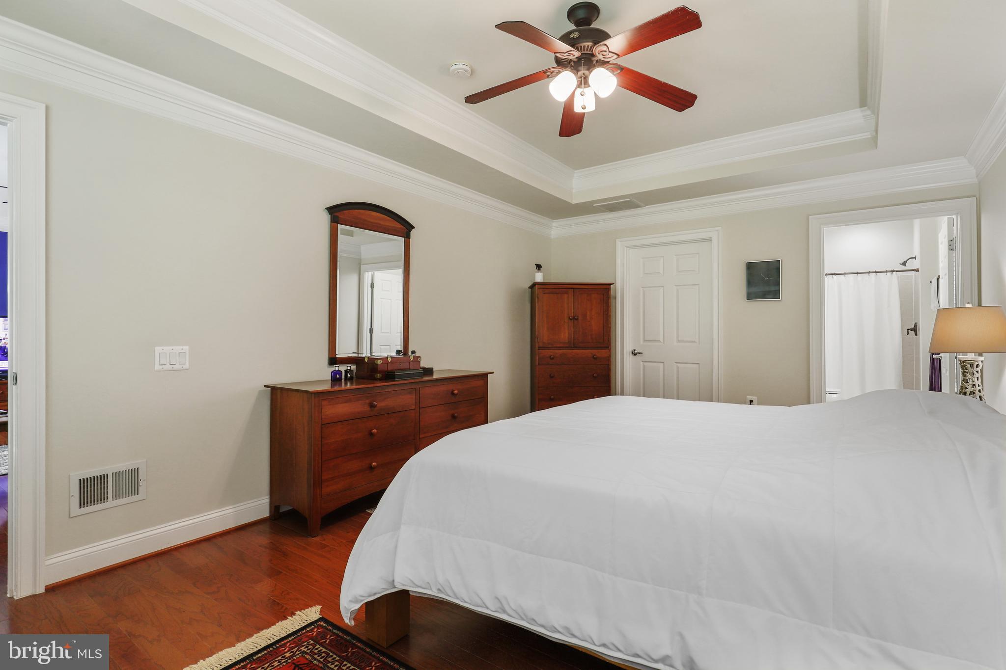 44268 Panther Ridge Drive Ashburn, VA 20147 - Photo 22 of 32 a bedroom with a bed and a dresser
