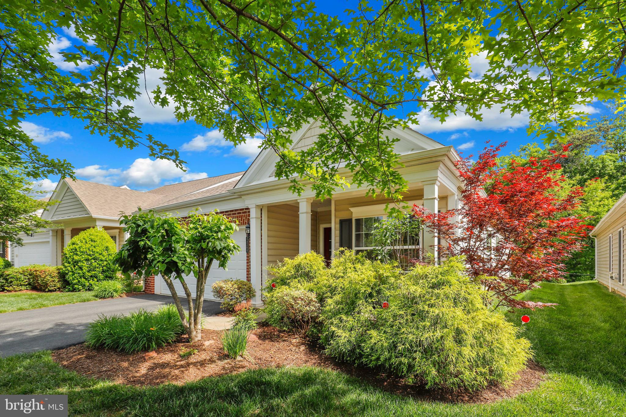 44268 Panther Ridge Drive Ashburn, VA 20147 - Photo 3 of 32 a front view of a house with garden
