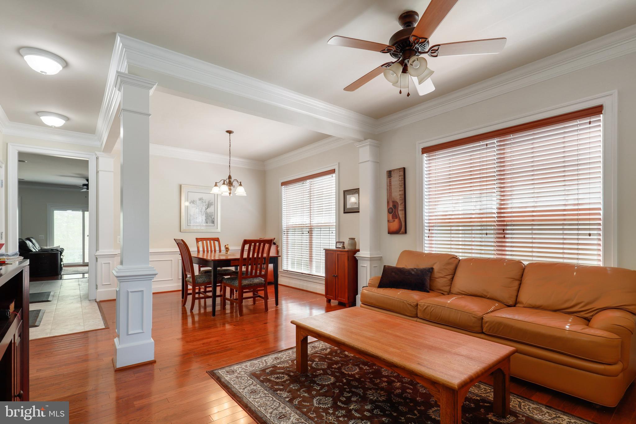 44268 Panther Ridge Drive Ashburn, VA 20147 - Photo 6 of 32 a living room with furniture a wooden floor and a window