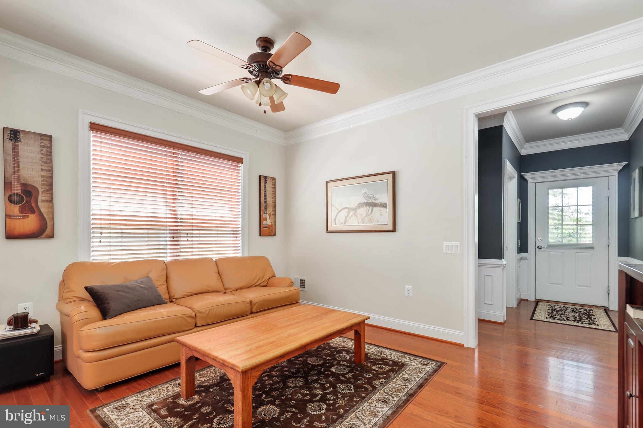 44268 Panther Ridge Drive Ashburn, VA 20147 - Photo 8 of 32 a living room with furniture and a window