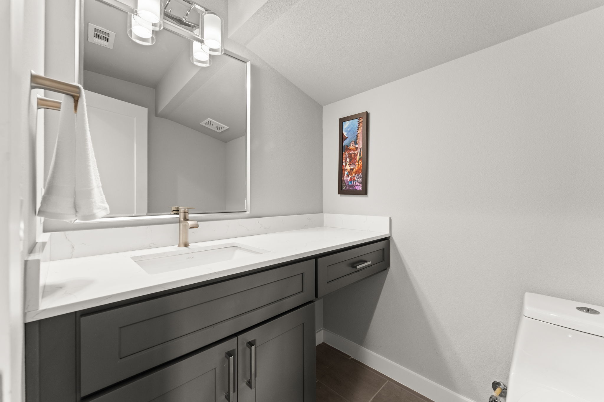 1116 Stobaugh Street, Unit A Austin, TX 78757 - Photo 30 of 37 a bathroom with a sink a mirror and a toilet