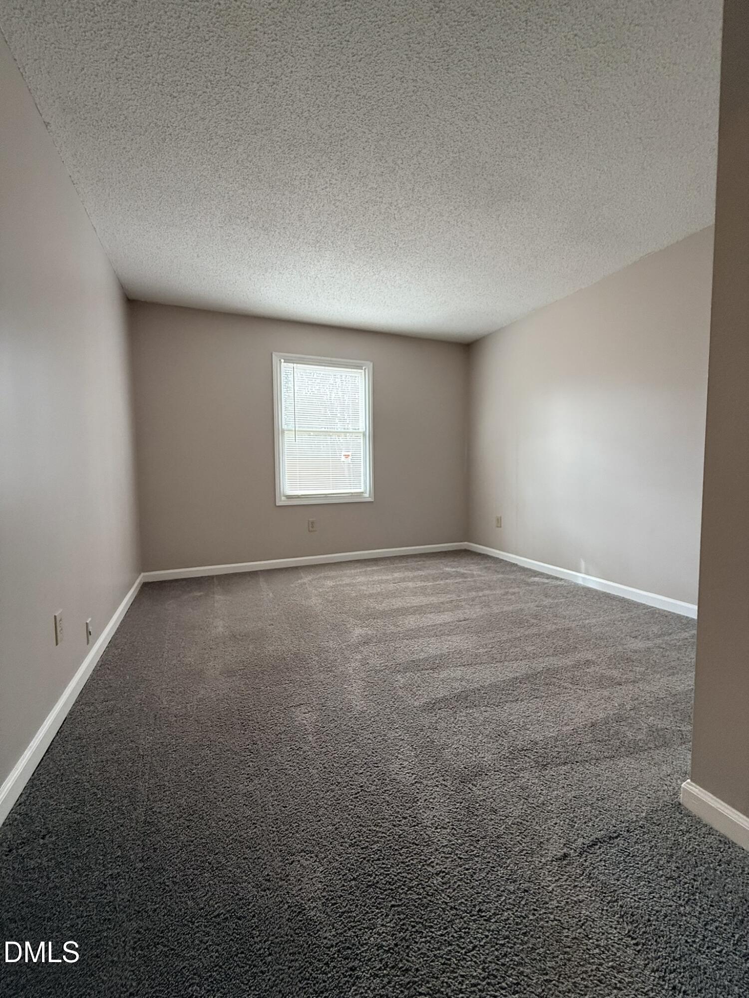 2120 Hawkins Street, Unit A Raleigh, NC 27610 - Photo 15 of 17 an empty room with a window