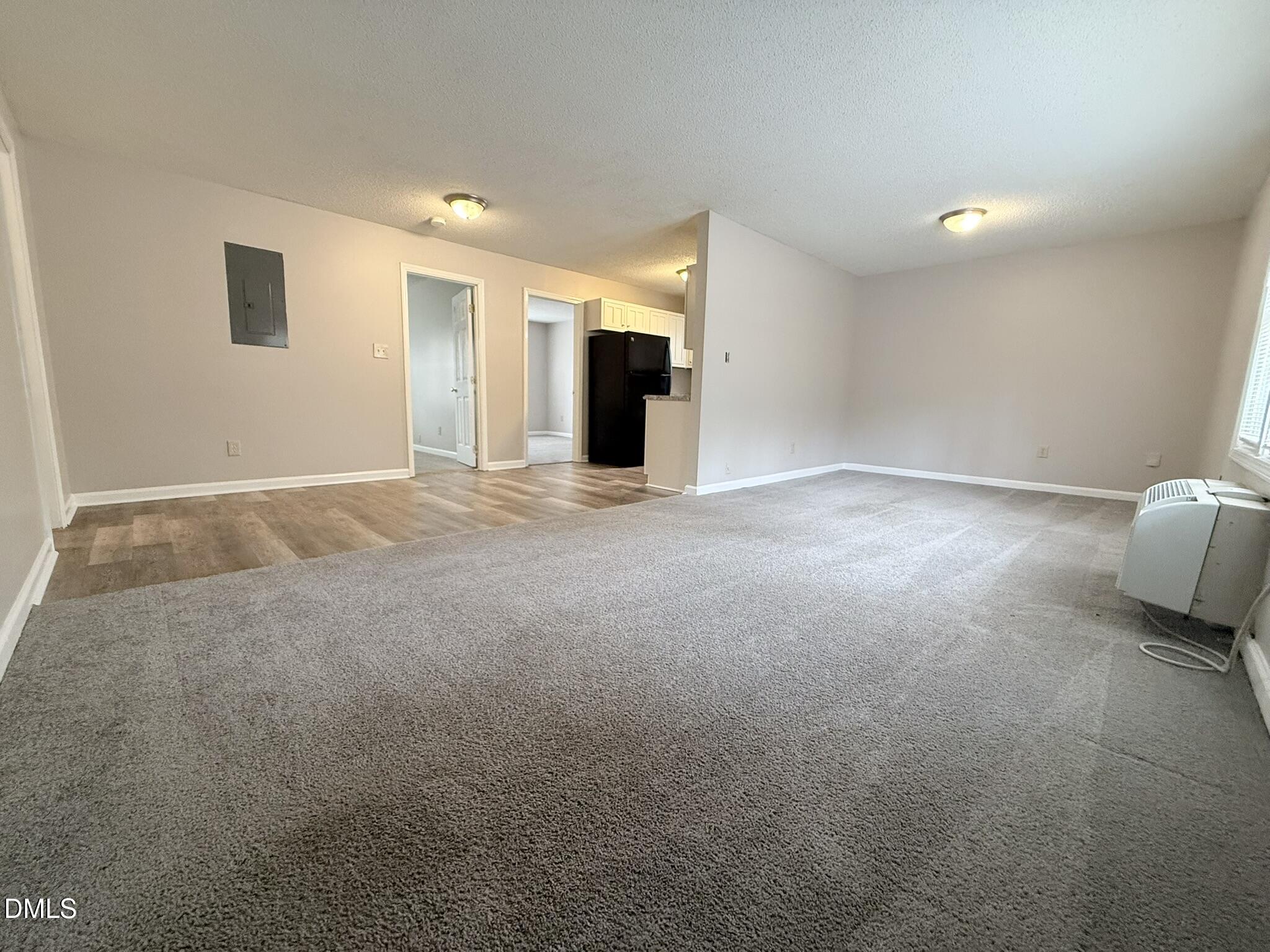 2120 Hawkins Street, Unit A Raleigh, NC 27610 - Photo 2 of 17 a view of an empty room with a fireplace