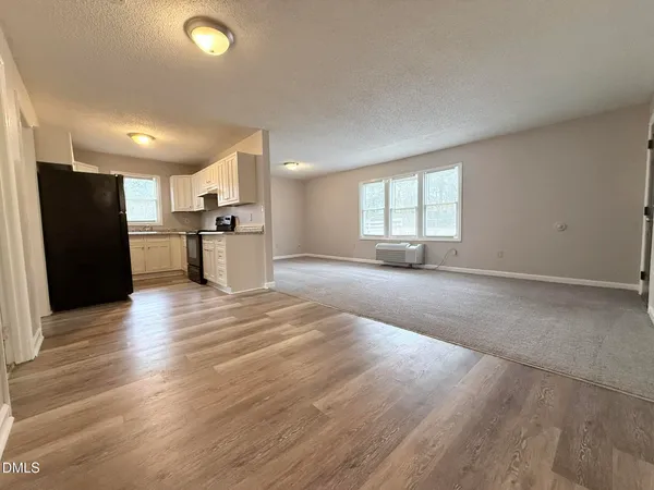 a view of a kitchen with a sink and a stove top oven