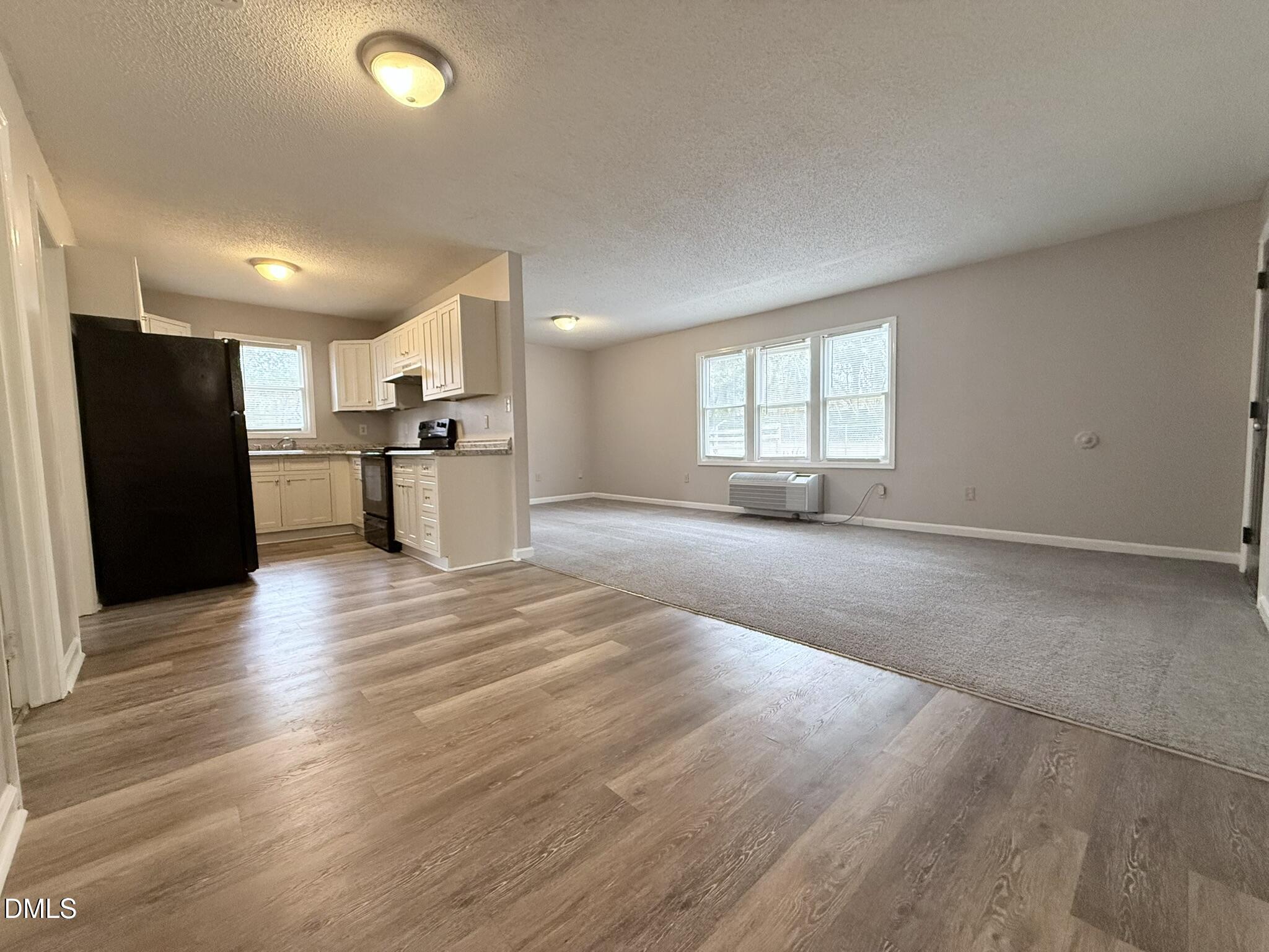 2120 Hawkins Street, Unit A Raleigh, NC 27610 - Photo 7 of 17 a view of a kitchen with a sink and a stove top oven