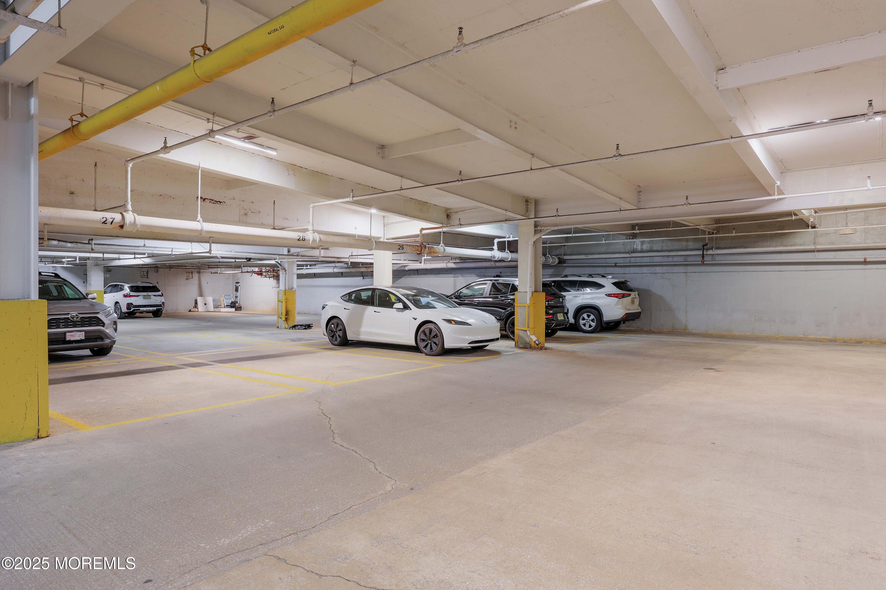 28 Riverside Avenue, Unit 7D Red Bank, NJ 07701 - Photo 16 of 28 a car parked in parking lot of parking
