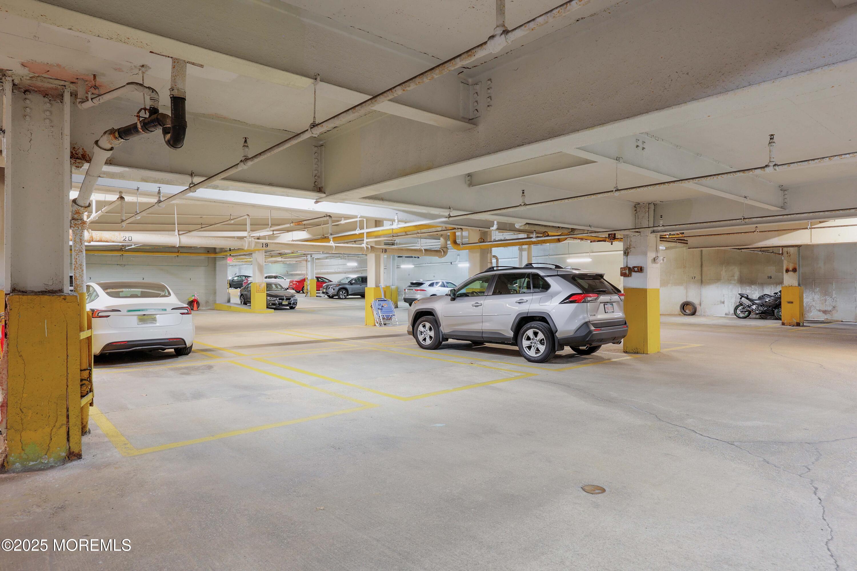 28 Riverside Avenue, Unit 7D Red Bank, NJ 07701 - Photo 17 of 28 a view of cars parked in a parking