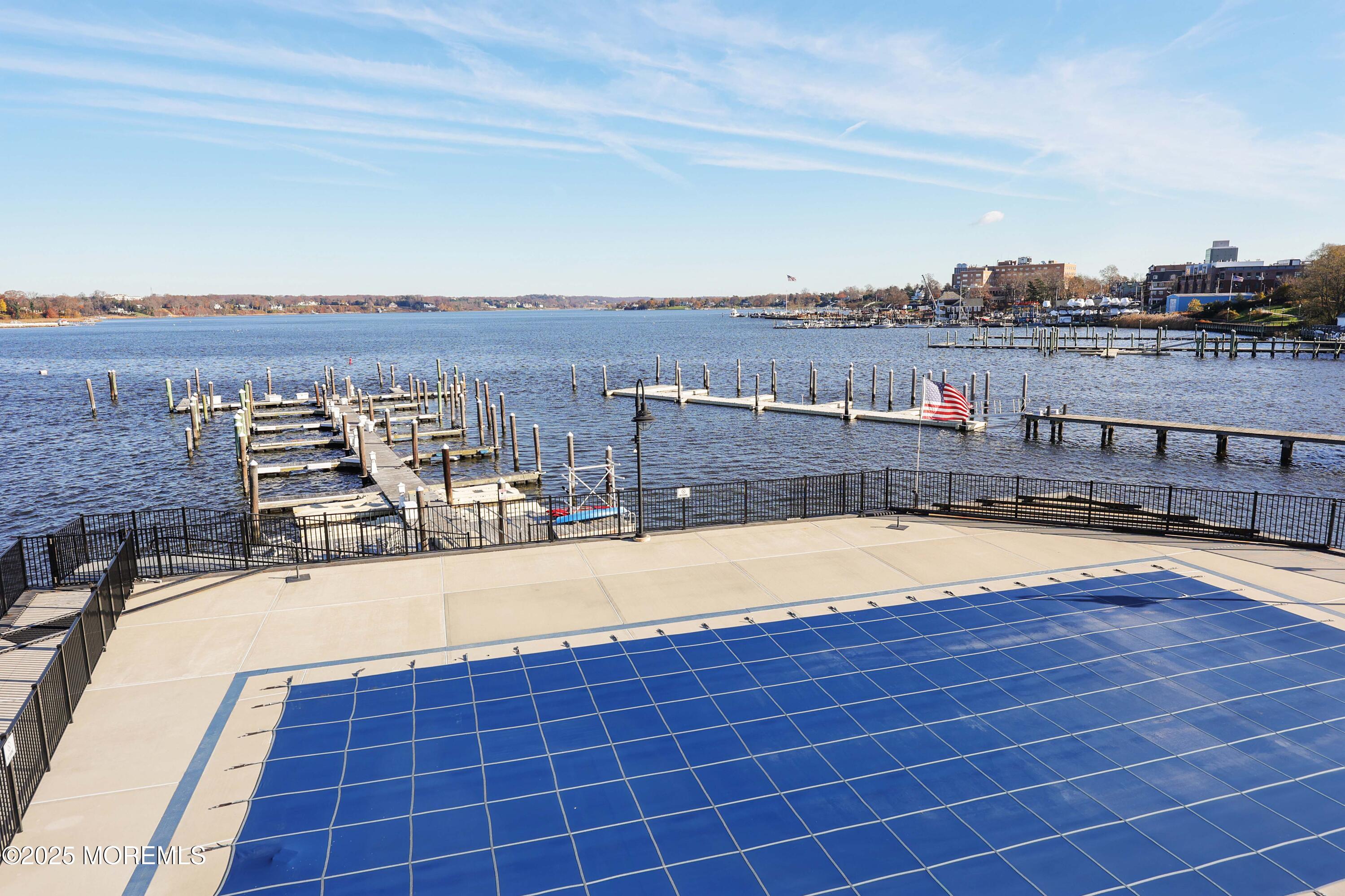 28 Riverside Avenue, Unit 7D Red Bank, NJ 07701 - Photo 22 of 28 a view of a swimming pool with an ocean view