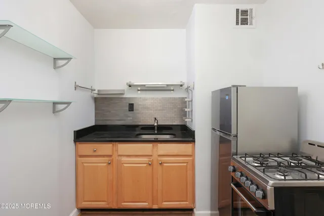 a kitchen with a stove and a microwave