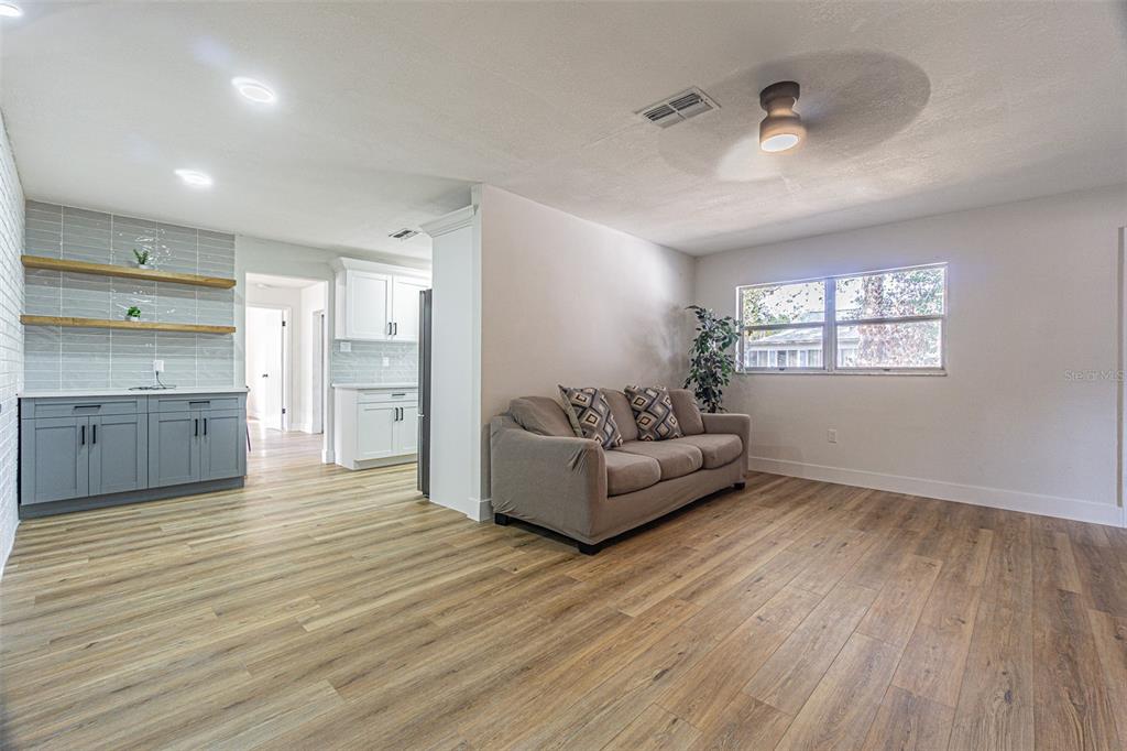 8405 Reynolds Drive Hudson, FL 34667 - Photo 16 of 30 a living room with furniture and a hard wood floor