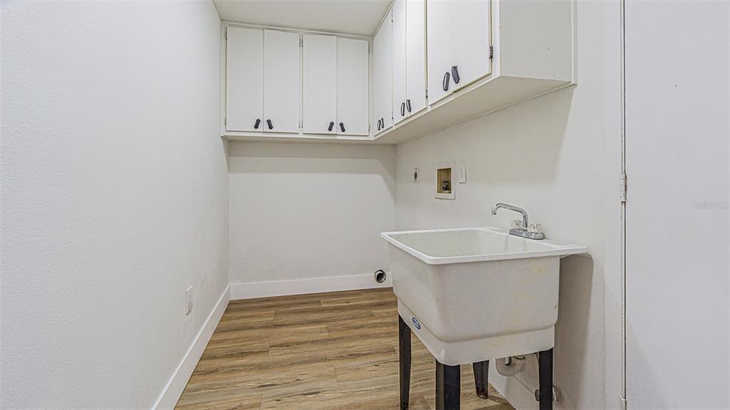 8405 Reynolds Drive Hudson, FL 34667 - Photo 24 of 30 a view of a hallway with washer and dryer