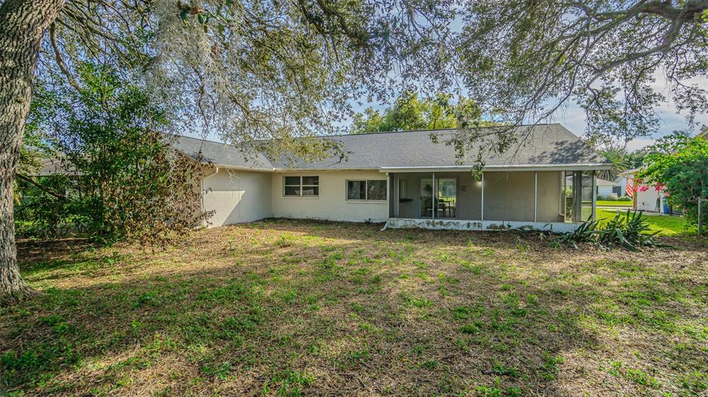 8405 Reynolds Drive Hudson, FL 34667 - Photo 28 of 30 a view of a house with a yard