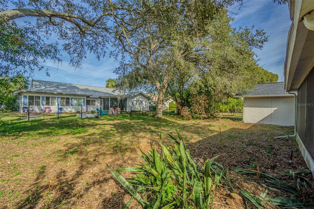 8405 Reynolds Drive Hudson, FL 34667 - Photo 29 of 30 a front view of a house with a yard