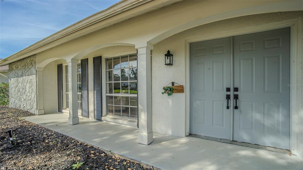 8405 Reynolds Drive Hudson, FL 34667 - Photo 4 of 30 an entrance view of a house
