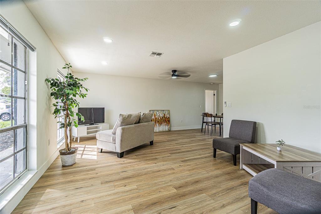 8405 Reynolds Drive Hudson, FL 34667 - Photo 5 of 30 a living room with furniture and a potted plant