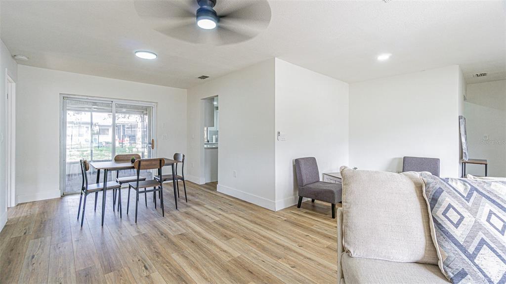 8405 Reynolds Drive Hudson, FL 34667 - Photo 6 of 30 a dining room with furniture and wooden floor