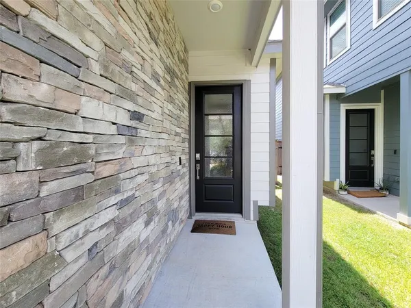a view of a door and wooden floor