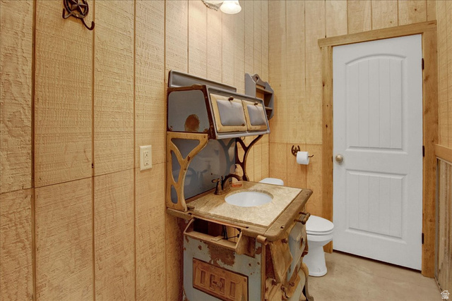 667 Hardscrabble Road Morgan, UT 84050 - Photo 48 of 51 Barn Bathrooom featuring vanity, concrete floors, and wallpapered walls