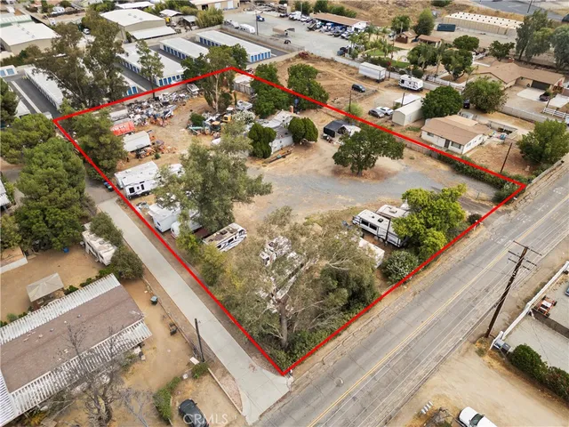 an aerial view of residential houses and car parked on street side