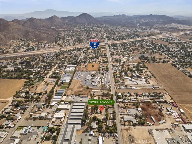an aerial view of residential houses with city view