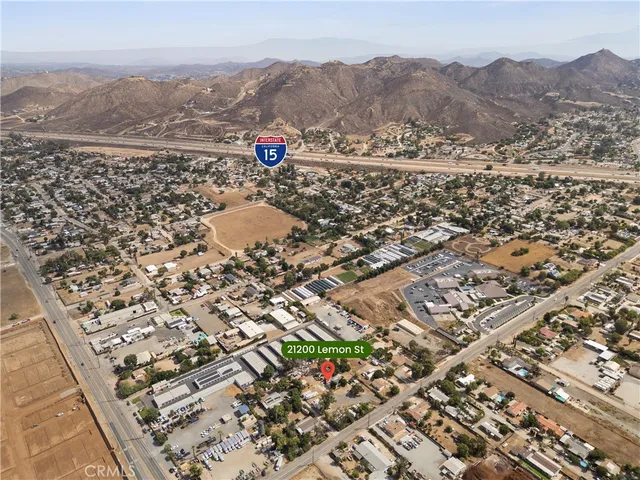 an aerial view of residential houses with city view