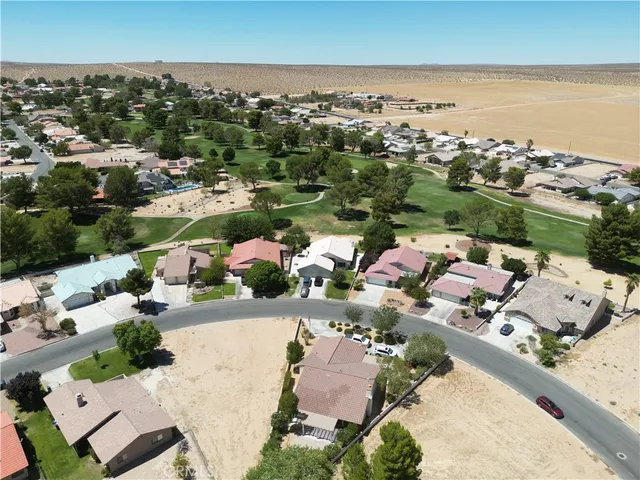 an aerial view of a house with a ocean view