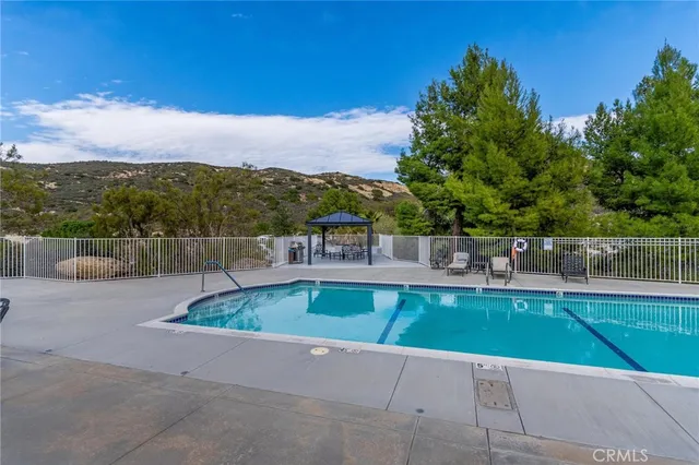 a view of a swimming pool with a lounge chair