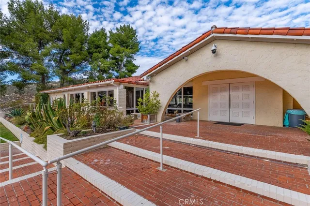 a view of house with wooden floor and a potted plant