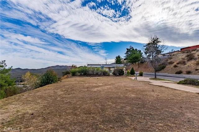 a view of a road with a building in the background