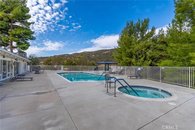 a view of a park with iron fence