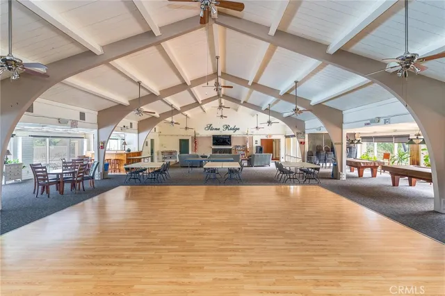 a living room with lots of furniture and chandelier
