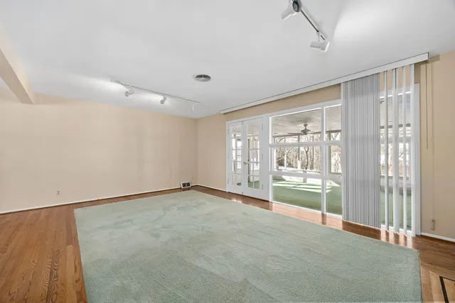 a view of an empty room with a window