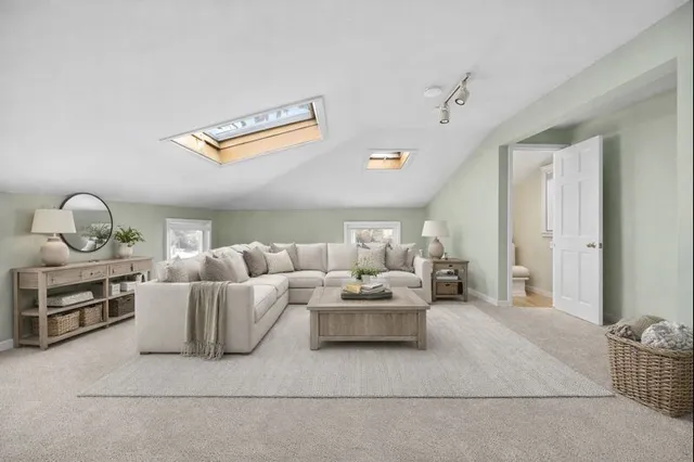 an empty room with a empty space and windows