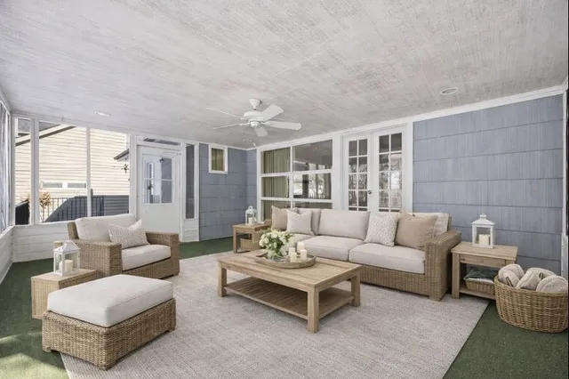 a view of an empty room with a window and staircase