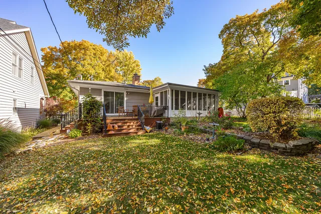 a view of a house with swimming pool and sitting area