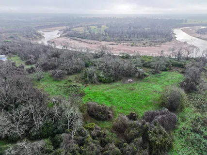 an aerial view of a houses with lake view