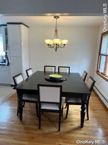 159-15 80th Street Queens, NY 11414 - Photo 5 of 13 a view of a dining room with furniture wooden floor and chandelier
