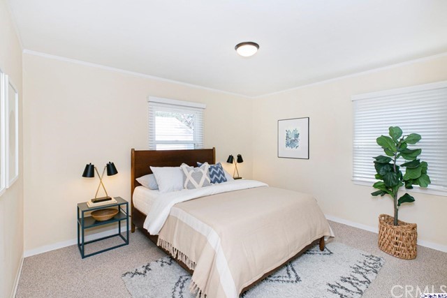 1446 North Harding Avenue Pasadena, CA 91104 - Photo 13 of 26 a bedroom with a bed and a potted plant