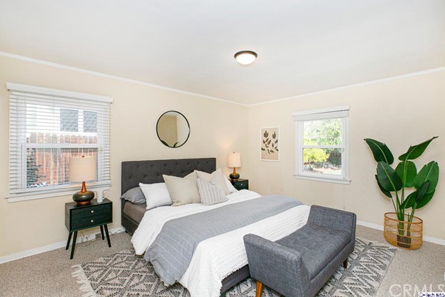 1446 North Harding Avenue Pasadena, CA 91104 - Photo 15 of 26 a bedroom with bed and a window with potted plant